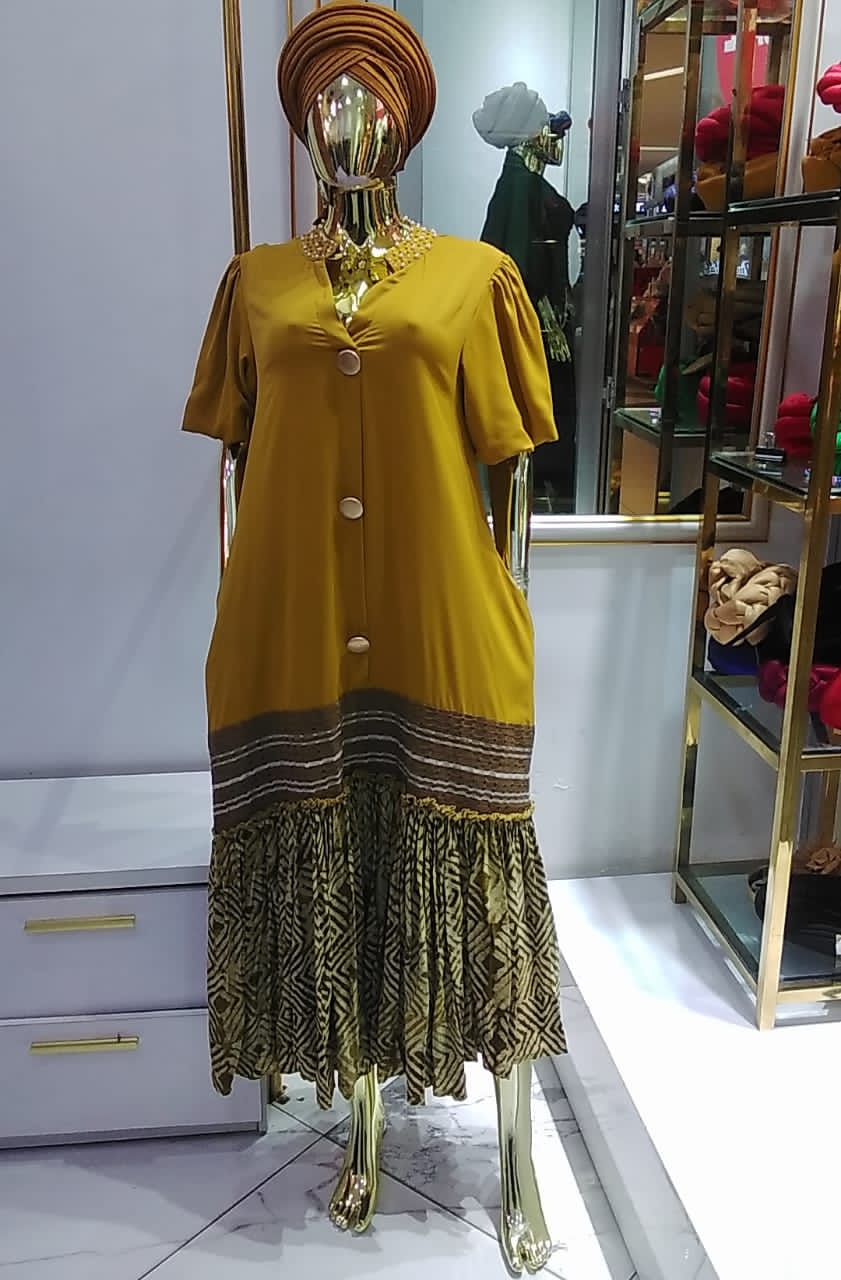 Silk kaftan gown with aso-oke and adire gathers
